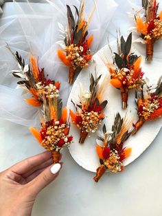 a plate with flowers and feathers on it