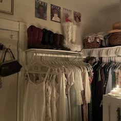 a closet filled with lots of clothes and shoes