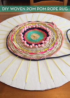 a table topped with a white plate covered in beads