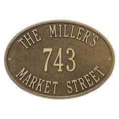 the miller's market street sign is shown in gold on an antique bronze background