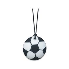 a black and white soccer ball ornament hanging from a cord