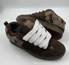 a pair of brown sneakers with white laces