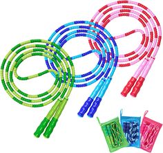 three neon colored jump ropes with handles on each side and one in the middle