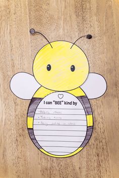 a paper bee with writing on it