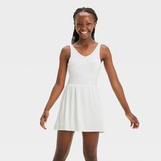 Why we're ALL IN: Solid-color sleeveless active dress with built-in shorts and a pleated skirt. Made from recycled polyester fabric with added spandex for flexible wear. Boasts moisture-wicking and quick-drying construction for comfort during any activity. The hidden pocket, built-in shorts, V-neckline and keyhole cut-out back complete the sporty design. All in Motion™: Inspiring the potential in every body. Active Dress, Sporty Design, Recycled Polyester Fabric, All In Motion, Hidden Pocket, Fabric Tape, Kids Outfits Girls, Moisture Wicking Fabric, Kids' Dresses