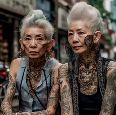 two older women with tattoos sitting next to each other