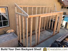 a house being built with wooden framing