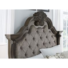 an ornate headboard with buttons on the top and bottom is shown in this image