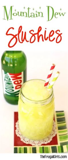 a jar filled with yellow liquid next to a bottle of mountain dew slushies