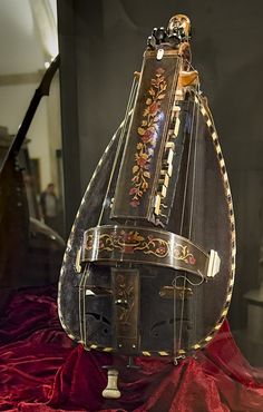 an ornate musical instrument on display in a case