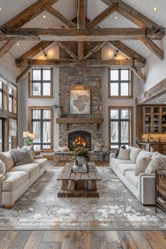 a living room filled with lots of furniture and a fire place in the middle of it