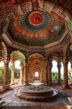 the inside of an ornate building with columns and arches, painted in multicolors