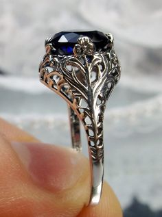 Excited to share the latest addition to my #etsy shop: 2ct Round Cut Sim Blue Sapphire Gemstone Sterling Silver Art Nouveau Floral Leaf Filigree Ring (Made To Order) {Design#198} https://etsy.me/3dMbvpq #blue #round #floral #yes #no #silver #women #artnouveau #antiqued Round Sapphire Filigree Jewelry, Ornate Sterling Silver Filigree Ring With Intricate Design, Elegant Sapphire Filigree Wedding Ring, Sapphire Filigree Jewelry For Wedding, Anniversary Sapphire Filigree Jewelry, Classic Sapphire Jewelry With Intricate Design, Silver Sapphire Filigree Jewelry, Ornate Round Cut Filigree Jewelry, Victorian Sapphire Jewelry With Filigree