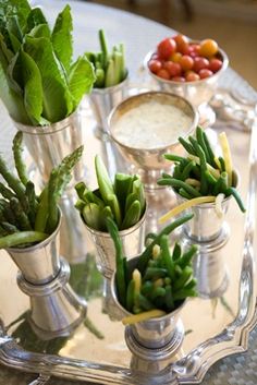 there are many different types of succulents in vases on the tray