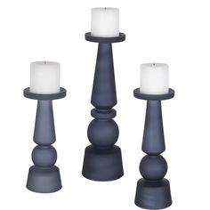 three candles sitting on top of each other