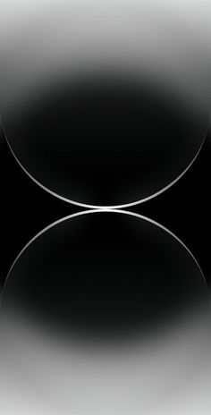 an abstract black and white photo with two circles