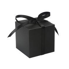 a black gift box with a ribbon on the top and bottom, isolated against a white background