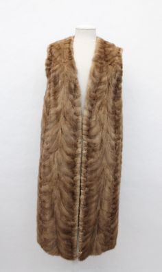 DESCRIPTION: BEAUTIFUL & VERY STYLISH PASTEL MINK FUR VEST FOR WOMAN! IT IS MADE FROM MINK SECTION FURS. THE COLLAR TYPE IS "V-LINE"AND IT HAS TWO SIDE POCKETS. THIS ITEM IS PRE-OWNED: THE FUR IS "MINT", THE SECOND BEST CONDITION POSSIBLE AND THE INSIDE LINING IS "EXCELLENT", THE BEST CONDITION!  AFTER BUYING THIS ITEM, IT WOULD BE VERY MUCH APPRECIATED IF YOU COULD PROVIDE YOUR HEIGHT, WEIGHT AND BUST CIRCUMFERENCE, SO WE CAN ADJUST THE COAT TO YOUR SIZE, BEFORE SHIPPING, IF NEEDED, THANK YOU! :) MEASUREMENTS:   SIZE: 4-6 SMALL LENGTH: 44" SLEEVES: N/A: MEASURED FROM SIDE/BOTTOM OF NECK TO CUFF. WHY YOU SHOULD BUY YOUR PRE-OWNED FURS ONLY FROM OUR COMPANY? BECAUSE WE SIZE AND REPAIR OUR COATS BEFORE SHIPPING AND WE OFFER A RETURN POLICY...NO RISK 100% SATISFACTION. BRAND NEW COATS: ONCE M Fur Vest Women, Mint Pastel, V Line, Vest Women, Long Vests, Second Best, Mink Fur, Fur Vest, Types Of Collars