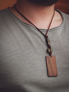 Hippie Long Necklace With Wood Pendant * Perfect gift idea for men * Boho/Minimalist Fashion * Handmade and natural Length of pendant: 5 1/2 cm Minimalist Brown Necklaces For Gifts, Minimalist Brown Necklace For Gifts, Minimalist Brown Necklace For Gift, Brown Waxed Cord Necklace For Gift, Brown Square Pendant Jewelry For Gift, Waxed Cord Pendant Necklace Gift, Handmade Pendant Necklace For Father's Day, Personalized Brown Necklace For Gift, Brown Rectangular Pendant Necklace As Gift