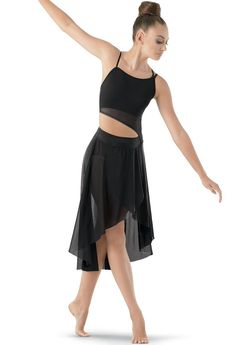 a woman in a black skirt and top is holding her arm out to the side