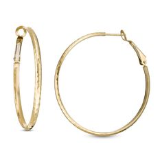 These 44.7 x 3.1mm hoop earrings are fashioned in 14K gold with a hammered finish and secure with omega backs. Yellow Gold Hammered Metal Hoop Earrings, Modern Hammered Hoop Earrings For Formal Occasions, Modern Hammered Hoop Earrings For Formal Events, Small Hammered Hoop Earrings For Formal Occasions, Elegant Hammered Hoop Earrings, 14k Gold Hammered Hoop Earrings, Modern 14k Gold Hammered Hoop Earrings, Elegant Hammered Round Hoop Earrings, Classic Hammered Hoop Earrings For Anniversary