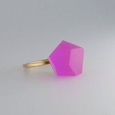 This ring has been carefully handcrafted in our workshop.  it has been designed to comply with our modular concept,  an idea that allows building and customising your own jewellery pieces.  this ring consists of two modules: top: vu crystals 12mm magenta pink acrylic resin crystal + ring band: minimal ring sterling silver  the top and the ring band are already assembled and the ring is ready to dazzle.  to swap your ring top you simply need to unscrew it by hand and replace with an alternative m Modern Pink Promise Ring, Minimalist Pink Open Ring Jewelry, Minimalist Pink Rings For Gift, Modern Pink Ruby Ring For Gift, Modern Pink Ruby Ring As A Gift, Minimalist Pink Wedding Rings, Pink Faceted Ring Jewelry, Unique Handmade Pink Ruby Ring, Handmade Unique Pink Ruby Ring