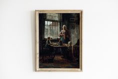 a painting hangs on the wall above a table with two children sitting at it,