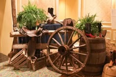 an old wooden wagon with plants in it sitting on the floor next to a wall