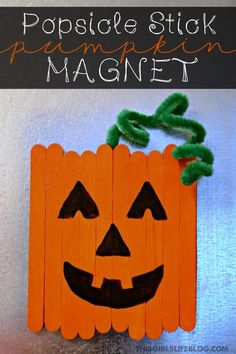 popsicle stick pumpkin magnet craft for halloween with text overlay that says popsicle stick pumpkin magnet