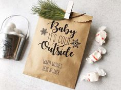 baby it's cold outside gift bag next to marshmallows