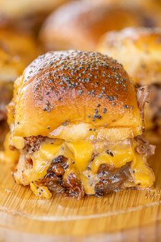 a cheeseburger on a wooden cutting board