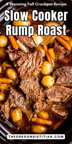 slow cooker roast with carrots, potatoes and beef in a crock pot