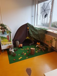 a room with a tent and toys on the floor