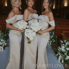 three bridesmaids pose for a photo in front of the alter