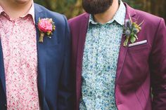 two men with beards and flower boutions standing next to each other in front of trees