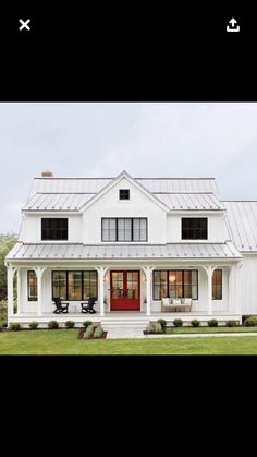 a white house with red door and windows