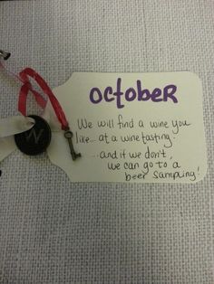 a note attached to a door hanger that says, october we will find a wine you like at a wine tasting