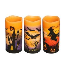 three candles with halloween images on them