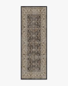 a rug with an intricate design on the bottom and sides, in black and beige colors