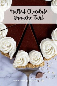 a chocolate ganache tart with white frosting on top