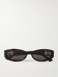 Gucci Eyewear's sunglasses are so chic, you're bound to reach for them often. They're made from tortoiseshell acetate with gold-tone 'GG' emblems at the temples and have sleek oval frames. Gucci Oval Sunglasses, Gucci Glasses Sunglasses, Sunglasses Women Aesthetic, Gucci Sunglasses Women, Random Accessories, Unrealistic Wishlist, Aesthetic Glasses, Shop Gucci, Glasses Ideas