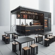 an outdoor food stand with tables and benches