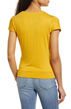 A faux-wrap front flatters on this soft and versatile jersey top cinched with a saucy tie at the hip. 23 1/2" length Surplice V-neck Short sleeves 95% rayon, 5% spandex Machine wash, dry flat Imported Women's Clothing Stretch Rayon V-neck Top, Fitted V-neck Rayon Top, Spring Ruched Viscose Tops, Summer Workwear Tops With Surplice Neckline, Fall Surplice Neckline Tops, Fitted Tops With Surplice Neckline For Spring, Fitted Solid Color Top With Twist Front, Fitted Twist Front Top, Spring Casual Tops With Surplice Neckline