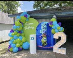 balloons and numbers are displayed in front of a birthday party sign at the entrance to a house