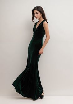 a woman in a long green dress