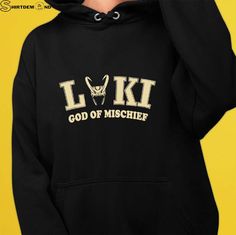 a person wearing a black hoodie with the words l k t on it and an image of a deer