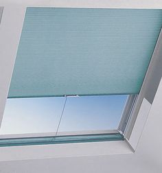 an open window with blinds on the outside