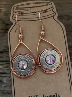 You are looking at a pair of 45 auto bullet earrings with an AB Swarovski crystal in the center. Rose gold plated. Shell Casings Crafts, Bullet Shell Jewelry, Shotgun Shell Jewelry, Bullet Casing Crafts, Shotgun Shell Crafts, Bullet Casing Jewelry, Hunting Jewelry, 45 Caliber, Western Fashion Jewelry