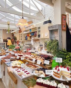 a table filled with lots of different types of cakes and desserts on it's sides