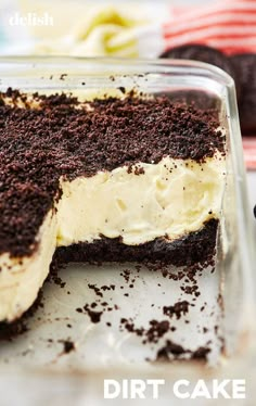 a chocolate cake with white frosting in a glass dish